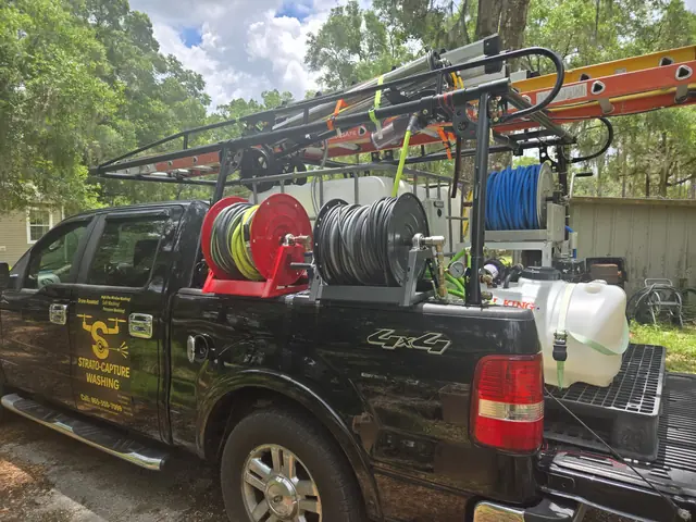 Side view of the service truck with its hose reel