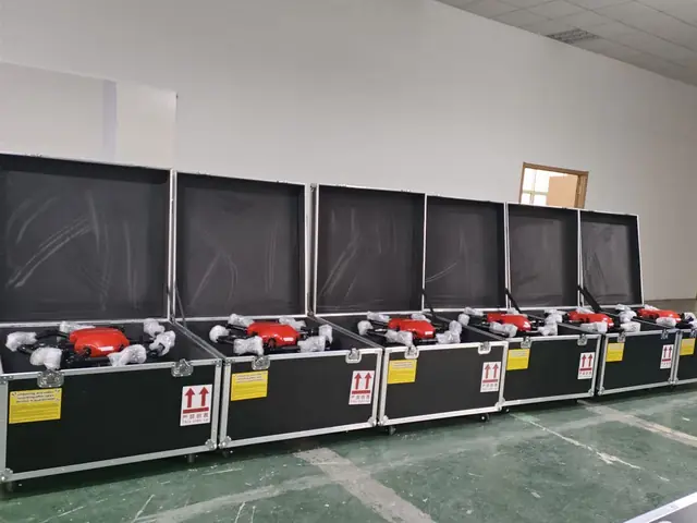 Red cleaning drones packed in flight cases, ready to ship