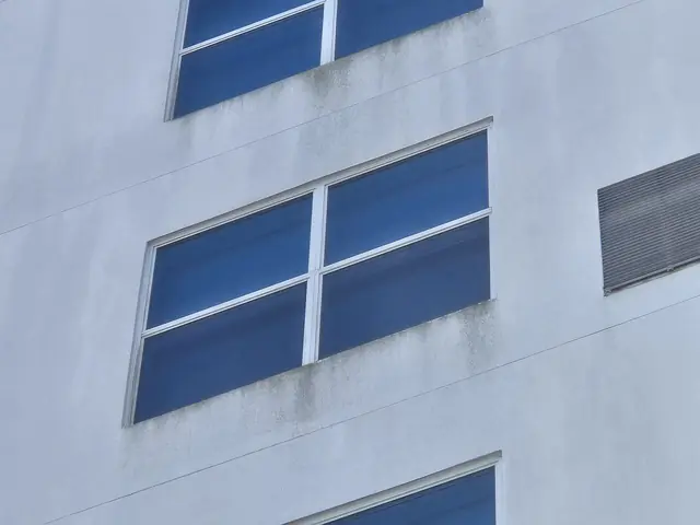 Clean white hotel façade and windows after drone cleaning