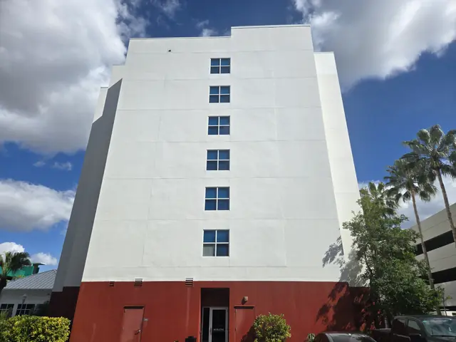 Full elevation of the hotel with clean white walls