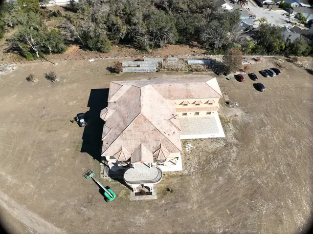Aerial view of the same tile roof after soft washing