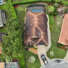Aerial view of a residential roof before cleaning