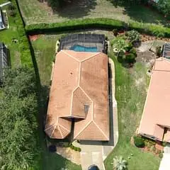 Aerial view of the same residential roof after cleaning